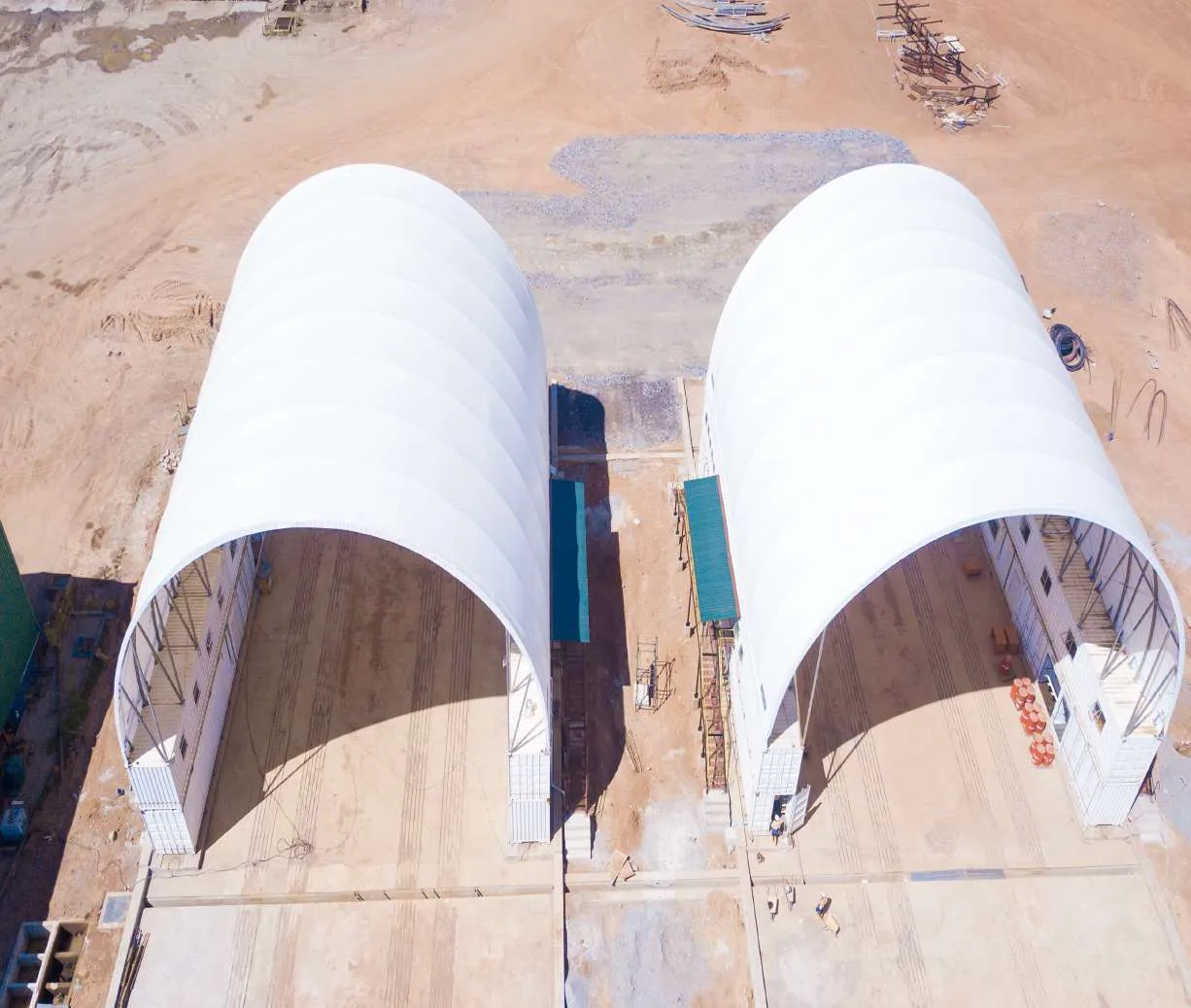 Aerial view of twin tensile-membrane heavy equipment workshops built by Ulmart Zambia at Barrick's Lumwana mine
